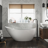 The Banksy stone freestanding bath in a  modern bathroom with matt black freestanding bath taps.