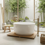 The Godwin stone freestanding bath in a Japandi style bathroom with brushed brass freestanding bath taps.