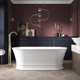 The Hepworth stone freestanding bath in a modern bathroom with brushed brass freestanding bath taps.