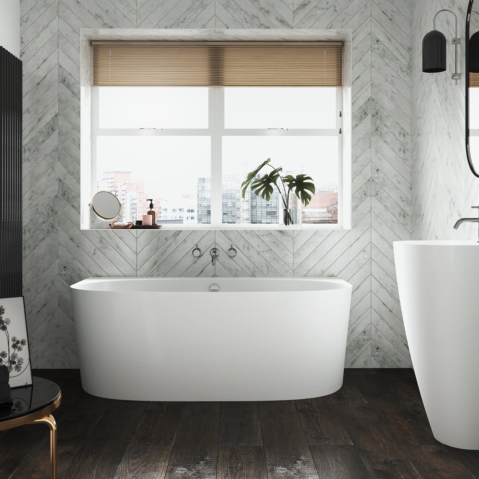 The Lawrence stone back to wall bath in a modern bathroom with the Marlow freestanding basin.